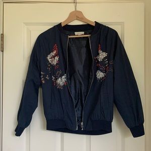 Blue bomber jacket with sequence design
